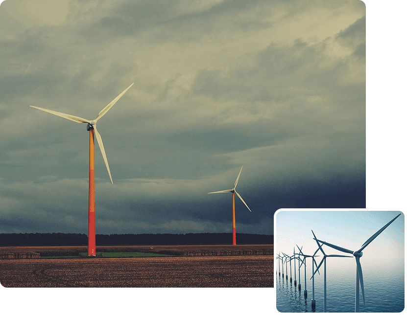 A field with wind turbines in the background.